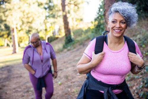 Two women of color on a hike in nature